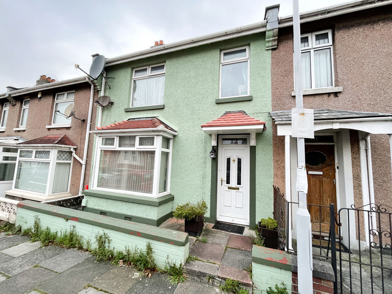 A deceptively spacious terraced family home. Entrance porch, hallway, sitting room, dining room, fitted kitchen, five bedrooms, two shower rooms, gardens, double garage, gas central heating, PVCu double glazing. EPC